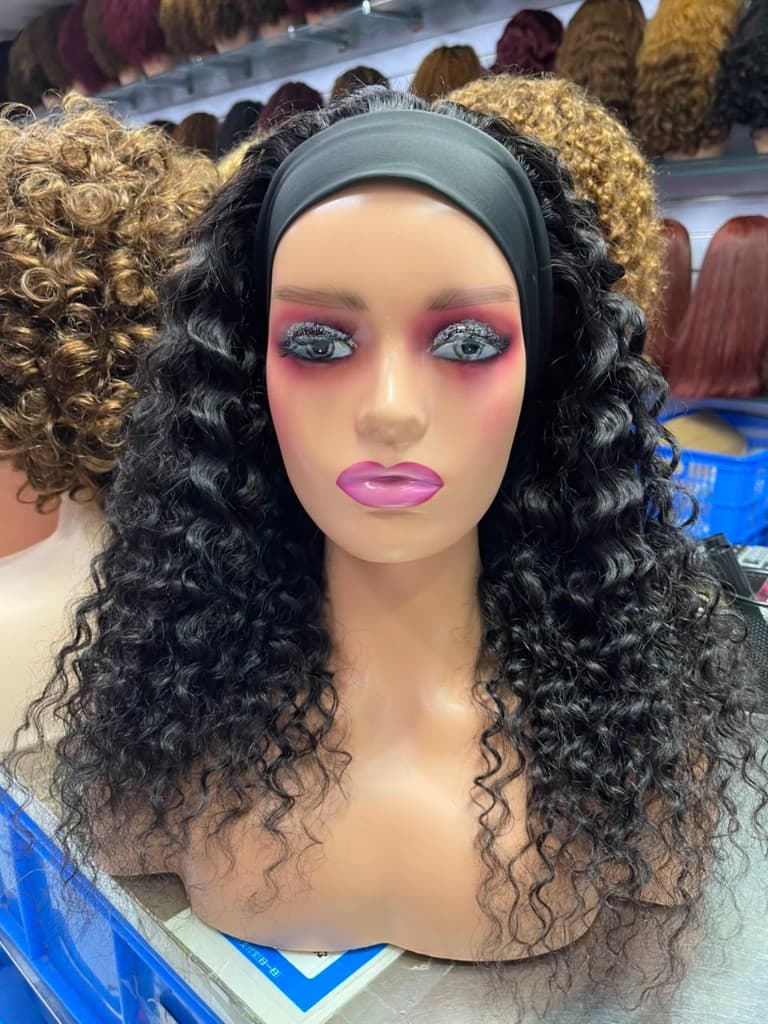 Curly bob lace front wig with defined curls on a mannequin