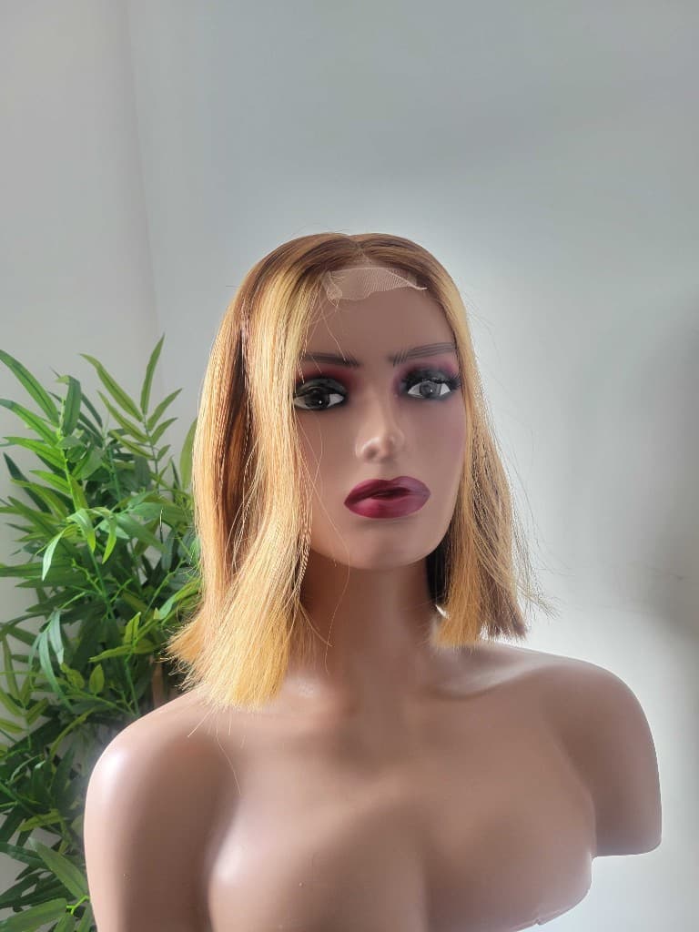 10-inch straight caramel blonde bob lace front wig with dark roots on a mannequin, front view